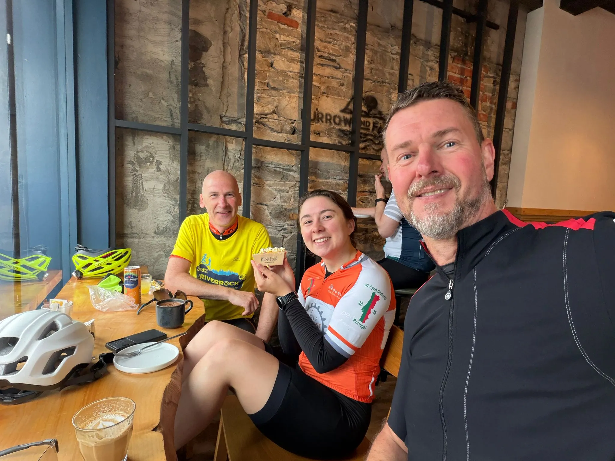 Emily Bond and two Titanic Quarter Cycling Club riders taking a break at a cafe