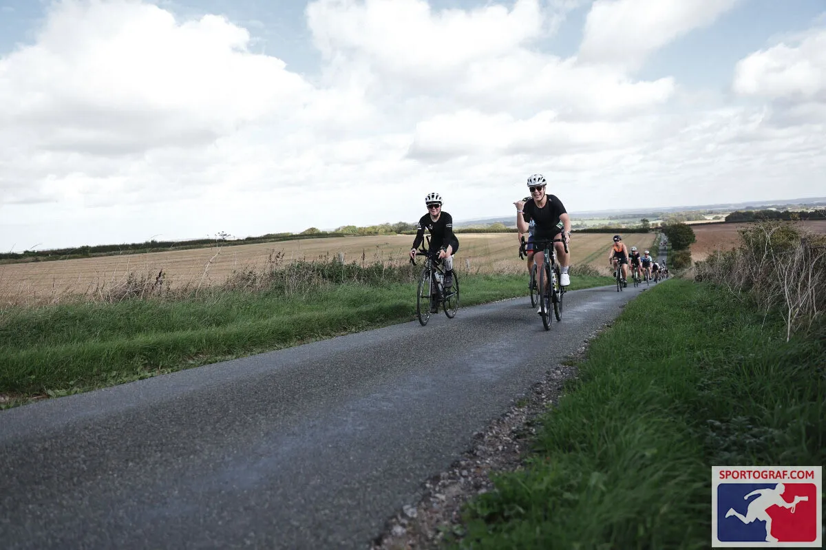 Emily Bond riding with a group on the IRONMAN 70.3 Weymouth bike course