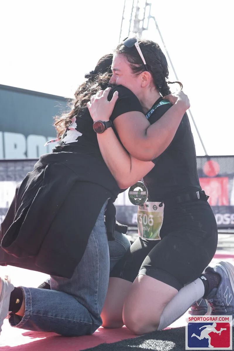Emily Bond embracing her best friend at the IRONMAN 70.3 Weymouth finish line